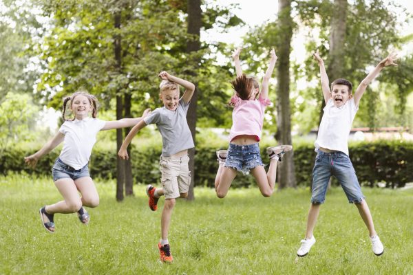 long-shot-kids-jumping-together